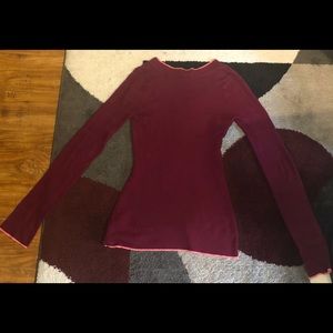 This is a tight fitted burgundy shirt